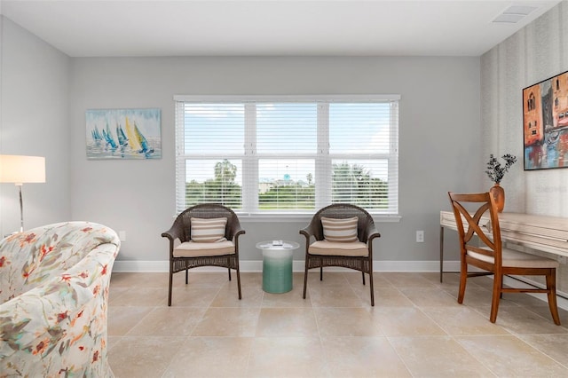 living area with light tile patterned floors