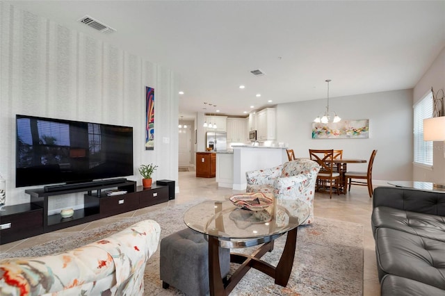 living room featuring a notable chandelier