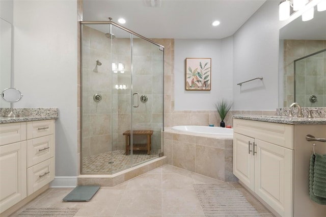 bathroom with separate shower and tub, vanity, and tile patterned floors