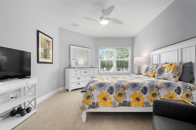 bedroom with ceiling fan and light colored carpet