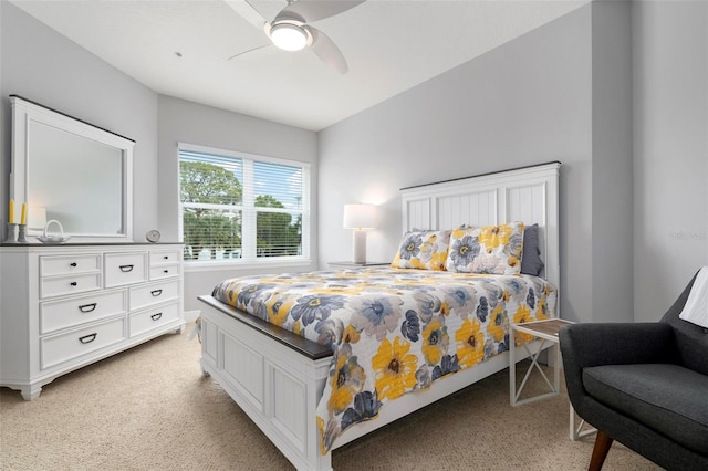 bedroom featuring ceiling fan and light carpet