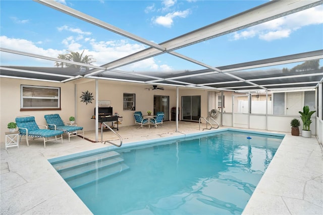 view of pool with a lanai and a patio