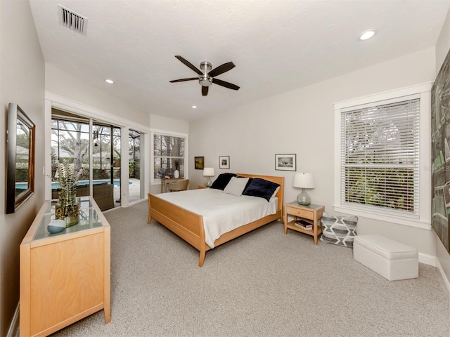 bedroom with ceiling fan, access to outside, and carpet floors