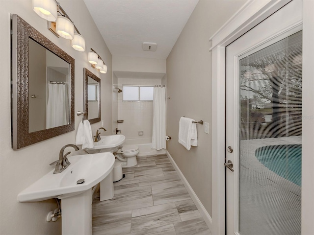 bathroom with toilet and shower / bathtub combination with curtain