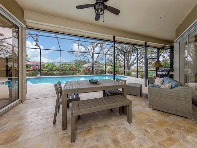 sunroom with a swimming pool and ceiling fan