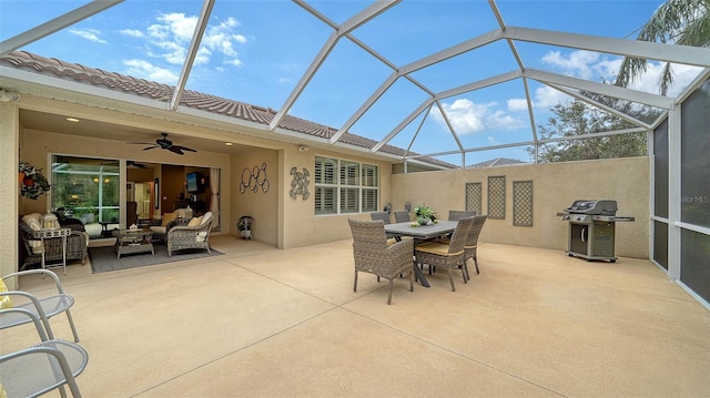 view of patio with a lanai, ceiling fan, a grill, and outdoor lounge area