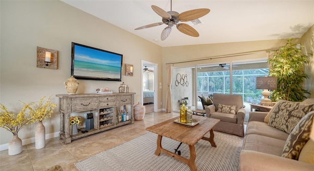 tiled living room with ceiling fan and vaulted ceiling