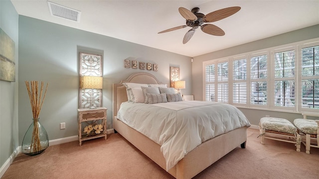 bedroom featuring ceiling fan and light colored carpet