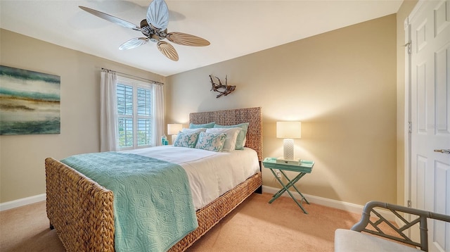 bedroom featuring ceiling fan and carpet