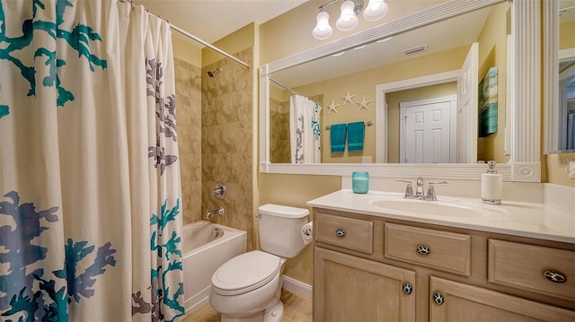 full bathroom with toilet, vanity, and shower / tub combo with curtain