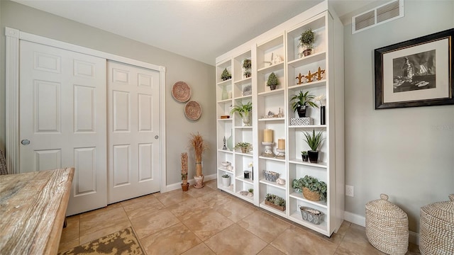 interior space featuring light tile patterned floors