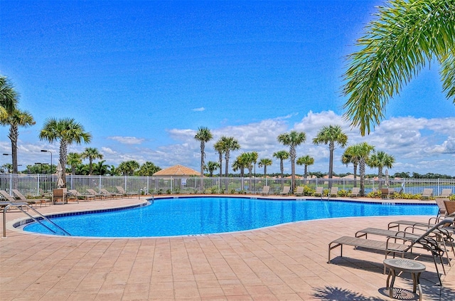 view of swimming pool featuring a patio area