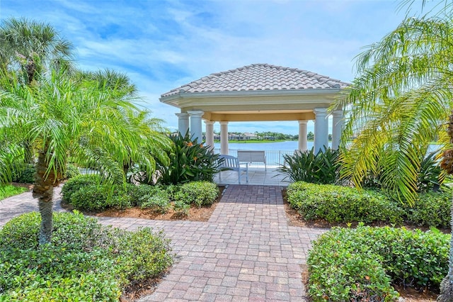 exterior space featuring a gazebo and a water view