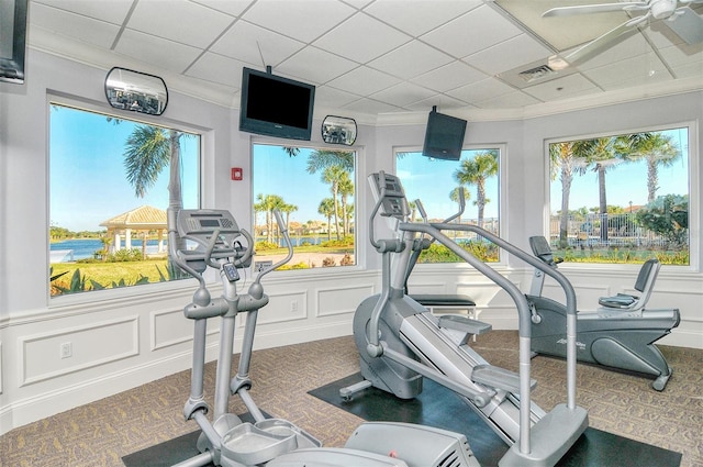 exercise room with carpet floors and a drop ceiling