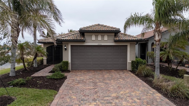 mediterranean / spanish house featuring a garage