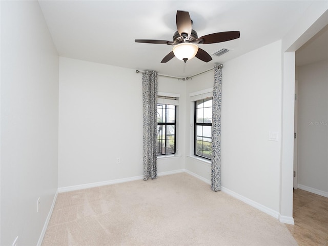 empty room with light colored carpet