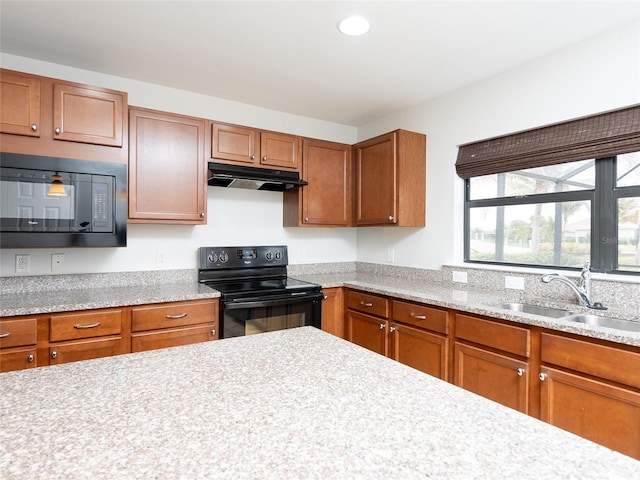 kitchen featuring sink and black appliances