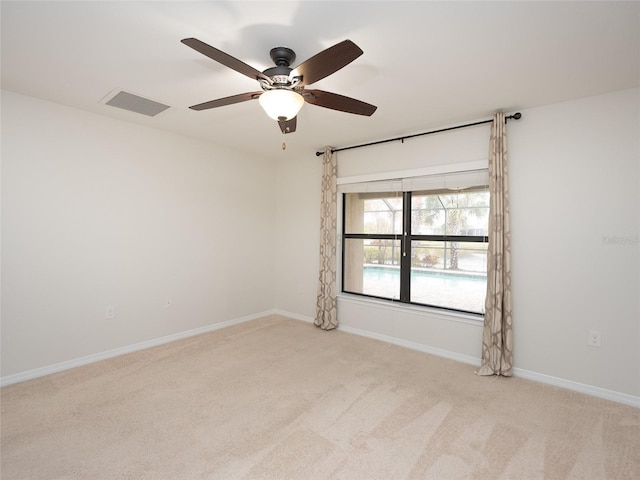 carpeted empty room with ceiling fan