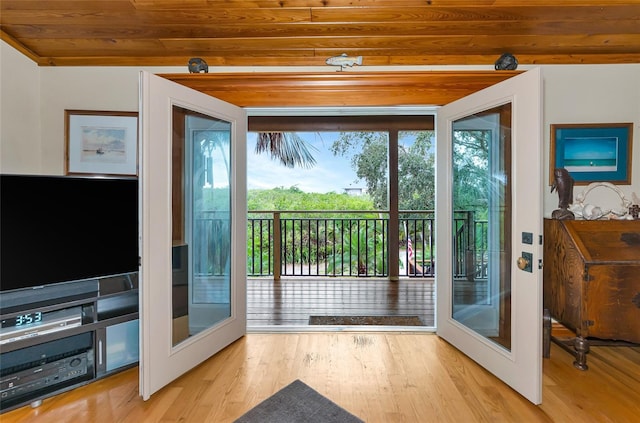 entryway with french doors, wood ceiling, and wood-type flooring