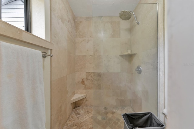 bathroom featuring tiled shower