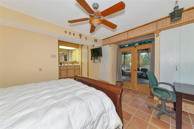 bedroom with ceiling fan, connected bathroom, access to exterior, french doors, and sink