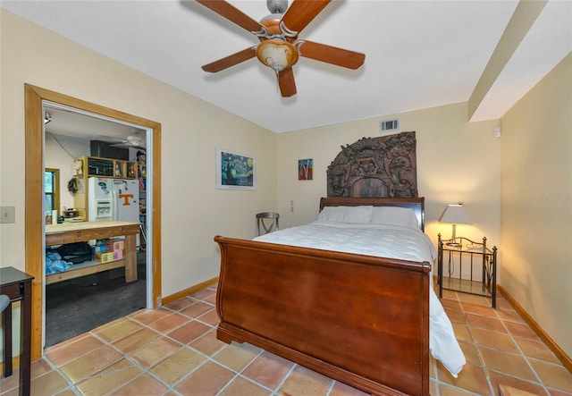 tiled bedroom with ceiling fan