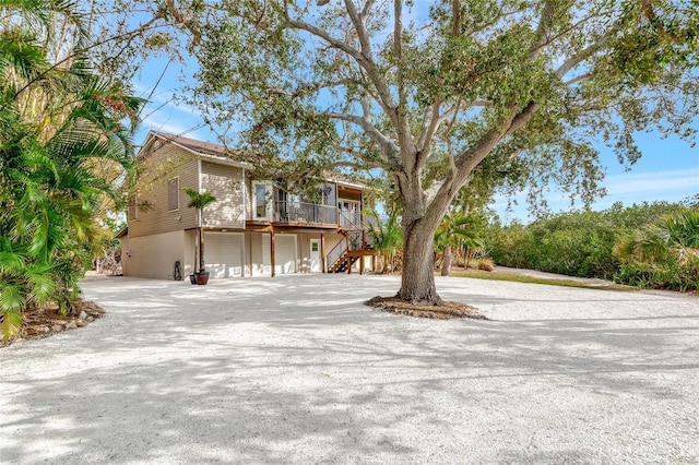 view of front of house with a garage and covered porch