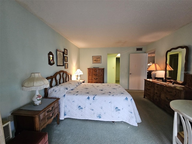 bedroom with dark colored carpet