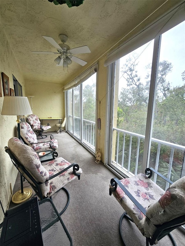 sunroom featuring ceiling fan