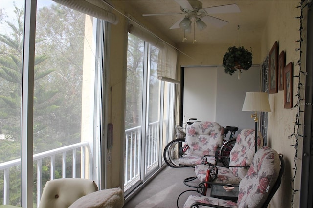 sunroom / solarium with ceiling fan and plenty of natural light