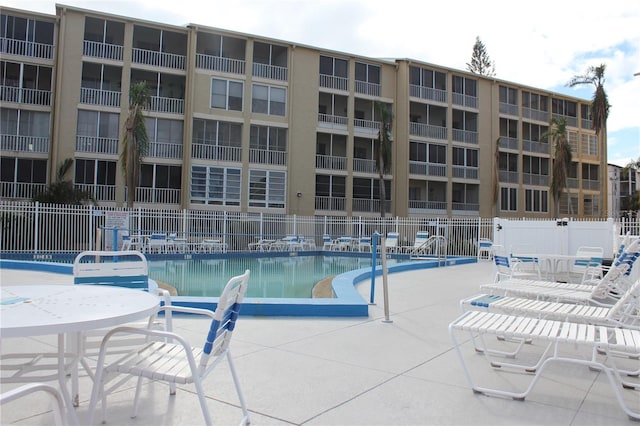 view of swimming pool with a patio area