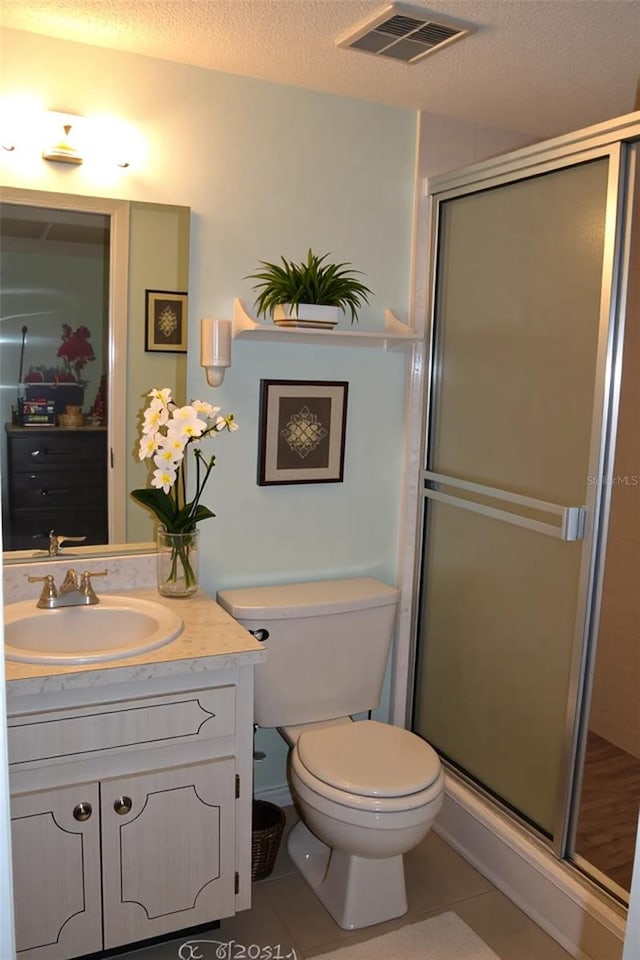3682 Lake Bayshore Dr Unit K402, Bradenton, FL 34205 - bathroom featuring tile patterned flooring, vanity, a shower stall, and a textured ceiling