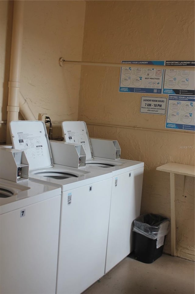 3682 Lake Bayshore Dr Unit K402, Bradenton, FL 34205 - shared laundry room with a textured wall and washer and dryer