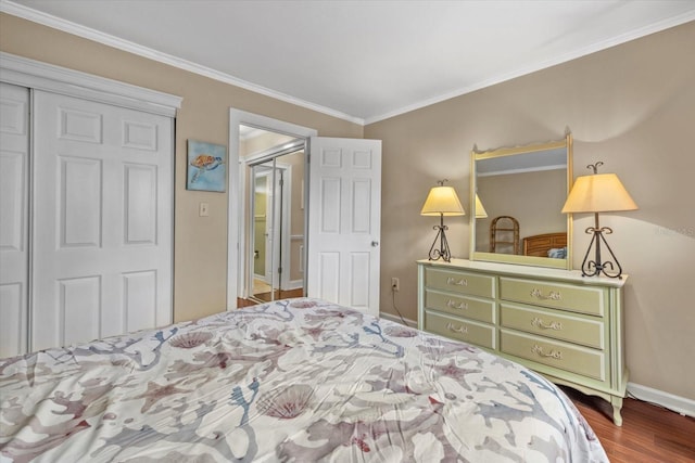 bedroom featuring a closet, ornamental molding, and dark hardwood / wood-style floors