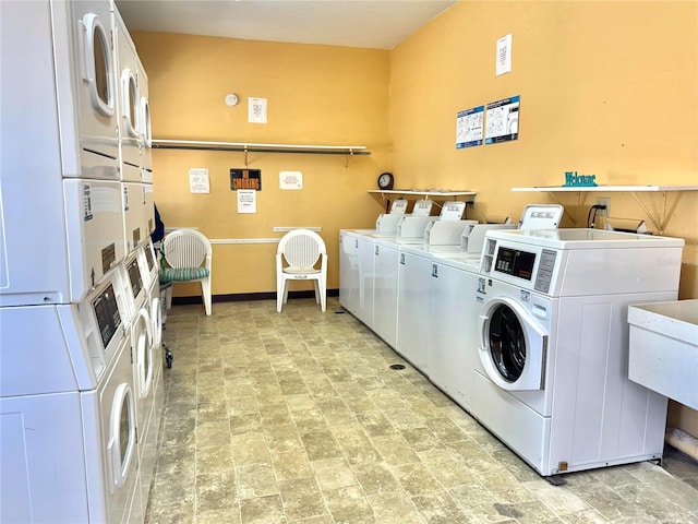 laundry room featuring stacked washing maching and dryer and independent washer and dryer