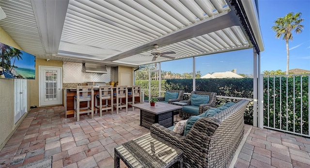 view of patio / terrace featuring exterior bar, outdoor lounge area, ceiling fan, and a pergola