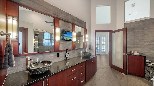 bathroom featuring walk in shower and vanity