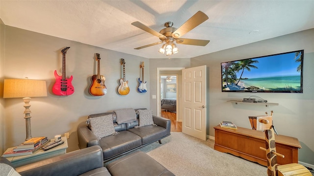 living room featuring ceiling fan and carpet flooring