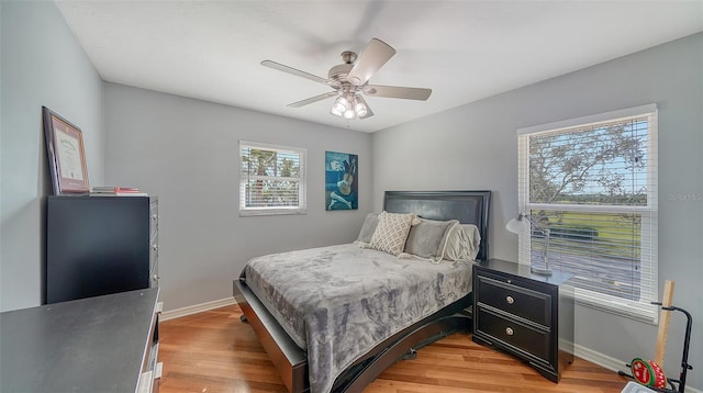 bedroom featuring light hardwood / wood-style floors and ceiling fan