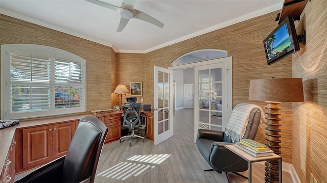 office featuring french doors, ceiling fan, ornamental molding, and light hardwood / wood-style flooring