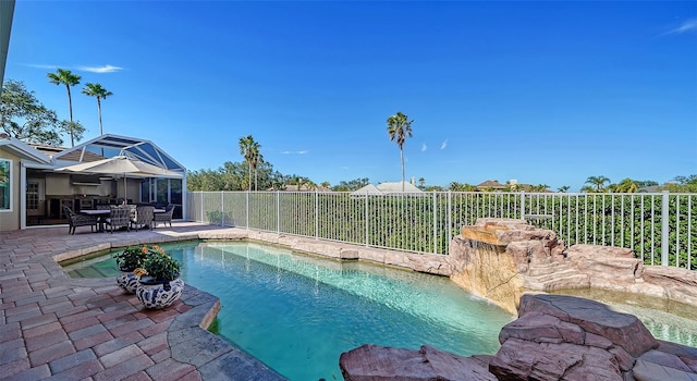 view of pool with a lanai and a patio area