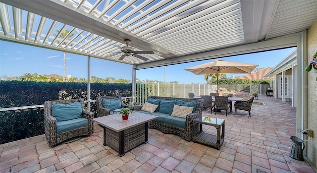 view of patio featuring ceiling fan, an outdoor hangout area, and a pergola