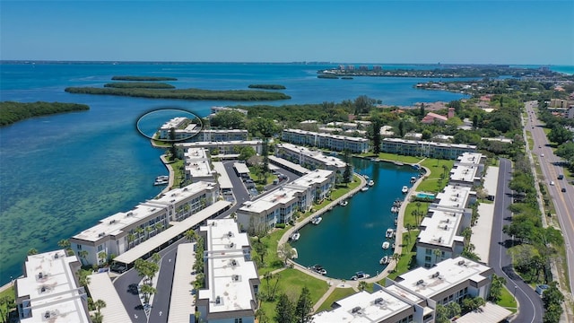 birds eye view of property featuring a water view