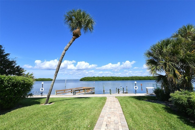 dock area featuring a lawn, a water view, and central AC unit