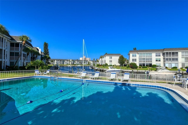 view of swimming pool with a water view