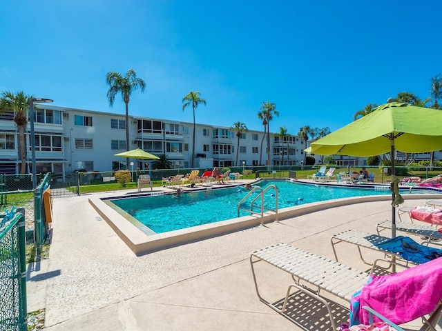 view of swimming pool featuring a patio area