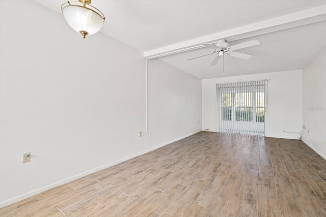 spare room featuring light hardwood / wood-style flooring, lofted ceiling with beams, and ceiling fan