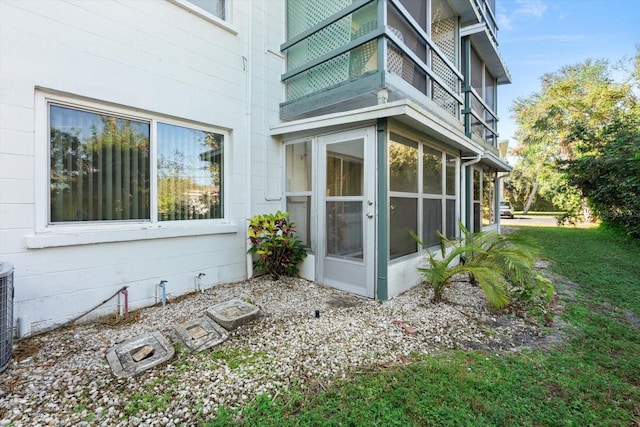view of home's exterior with a lawn