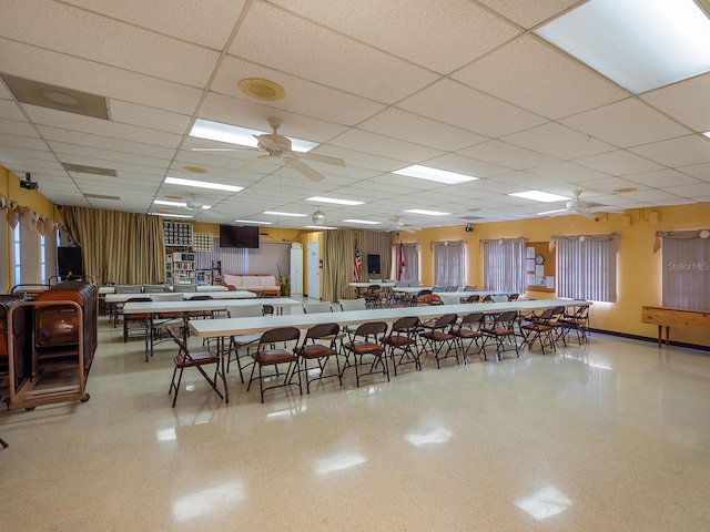 dining room featuring ceiling fan and a paneled ceiling