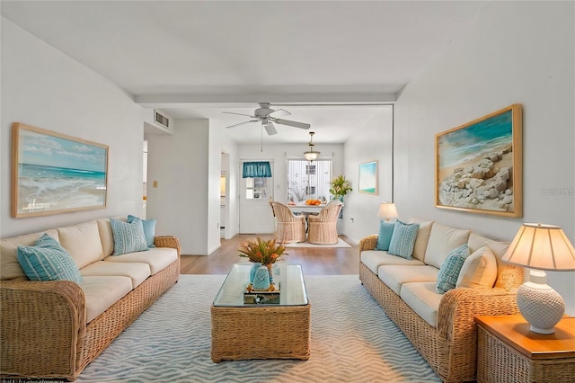 living room featuring hardwood / wood-style flooring and ceiling fan